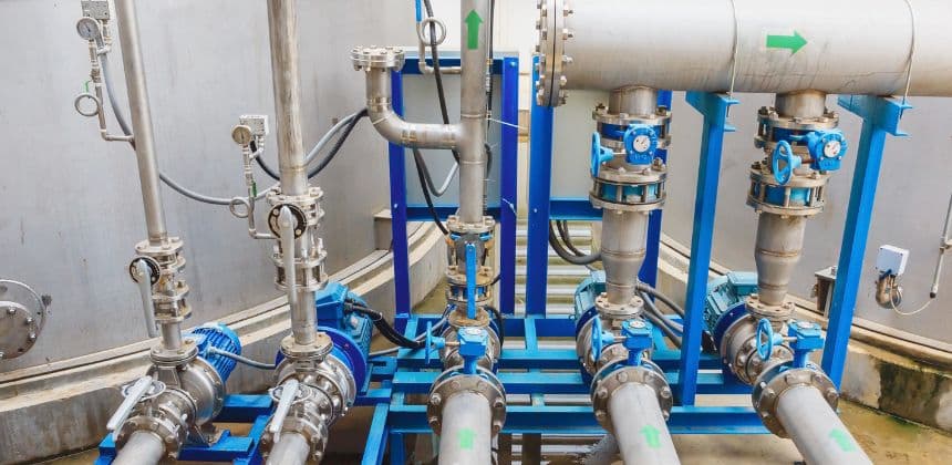 Complex industrial piping and valve systems, demonstrating engineering for liquid transfer and control of pump head losses